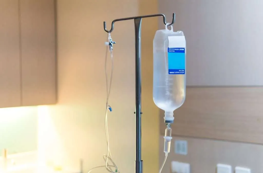 Subcutaneous fluids - bag of fluids hanging for cat at vet clinic.